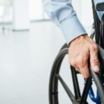 Male in wheel chair in workplace