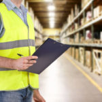 Warehouse worker hold a clipboard