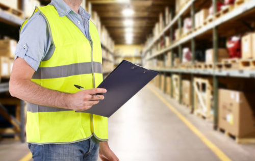 Warehouse worker hold a clipboard