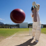 Cricket batsman hitting ball