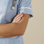 Nurse folding arms with watch