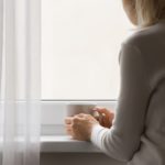 woman looking out of window