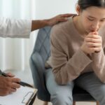 Young woman receiving counselling.