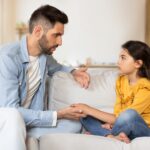 Father talking to daughter about divorce