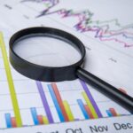 Carrying out due diligence for the buying or selling of a business.