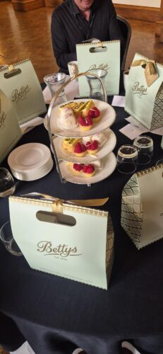 A table displaying Bettys cakes from the Bettys & Taylors Group afternoon tea session.
